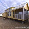 The Eagles Landing P-535 model by Platinum Cottages and RRC Athens. This floorplan features an optional island kitchen and lots of storage. Shown with optional screened in porch, clerestory windows, & more. Previously on display @ Recreational Resort Cottages Athens Tx