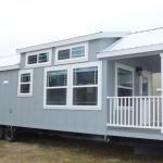 The Honeysuckle Model P-504 by Platinum Cottages and RRC Athens. This wheelchair friendly model features a roll-in shower w/ grab bars and a fold down seat. it also features wider doorways and other features making accessibility easier.