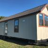 The Magnolia P-518 front kitchen model by Platinum Cottages previously on display @ RRC Athens. This model is shown with optional clerestory windows and more.