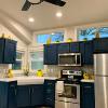 The Premier kitchen with Gale force blue cabinets and a 2 window clerestory window option.